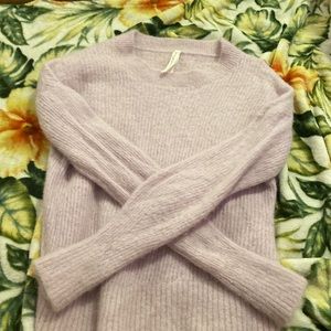 This is a cozy purple littleed sweater fuzzy interior and a size large